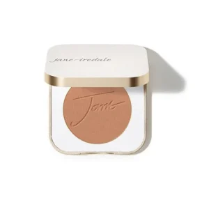 Pressed powder compact in a peachy nude shade, white case with a gold trim and embossed 'Tone' on the powder.