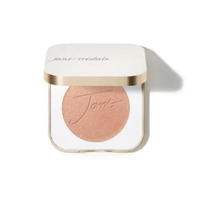 Peach-toned pressed powder blush in a white compact with a gold rim and Jane Iredale branding.
