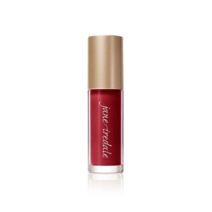 Red lipstick in a clear tube with a gold cap, branded 'Jane Iredale' along the side, standing upright on a white background.