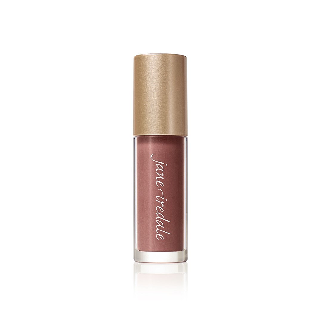3154505270jpg – Damara Luxury Spa Vancouver Lip gloss bottle in rosy nude shade with a metallic gold cap, labeled Jane Iredale, standing upright.