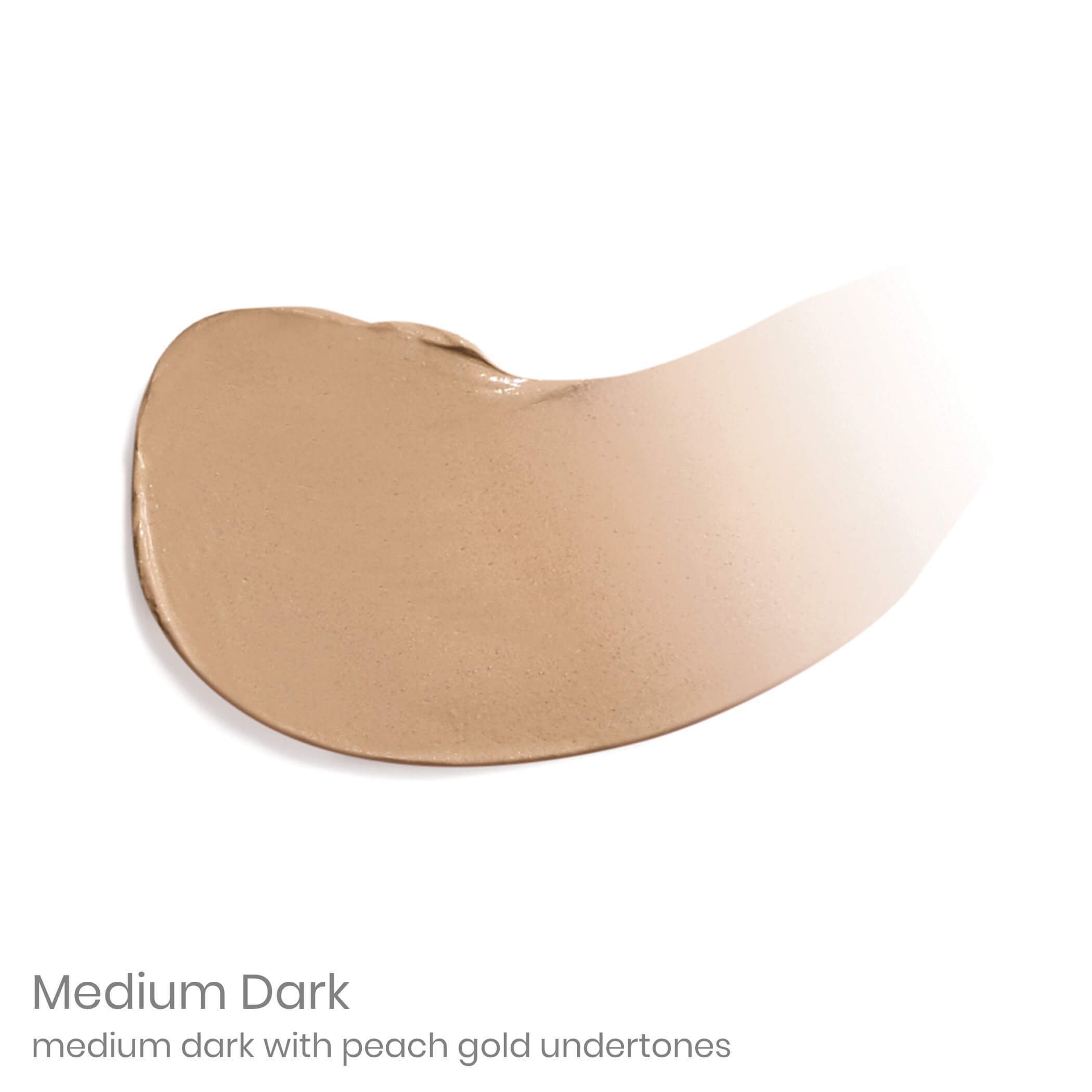 4006948076jpg – Damara Luxury Spa Vancouver Close-up of a beige foundation swatch in a medium-dark shade with a creamy texture and part of the label reading 'Medium Dark' nearby