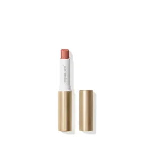 Pink lipstick in a white case centered, flanked by two gold lipsticks on a white background.
