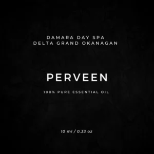 Label for PERVEEN essential oil by Damara Day Spa, Delta Grand Okanagan; 100% Pure Essential Oil, 10 ml / 0.33 oz, on a dark textured background.