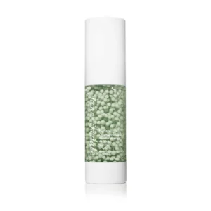 White cosmetic serum bottle with a clear section showing green beads; label reads HydroPure Color Correcting Serum.