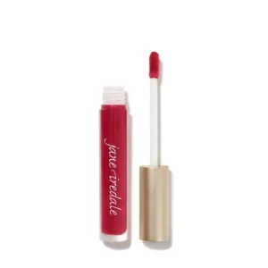 Red lip gloss tube with wand applicator beside it on a white background with a pink-red shade visible in the tube and the wand cap removed to reveal the applicator.