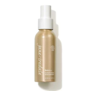 White spray bottle with a white nozzle and a beige-gold body, labeled Balance Hydration Spray (cosmetic) in white script on the bottle.