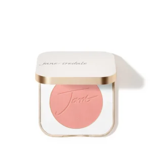 Close-up of a white makeup compact with pink pressed powder labeled 'jane iredale' on the lid of the compact area visible from the top edge.