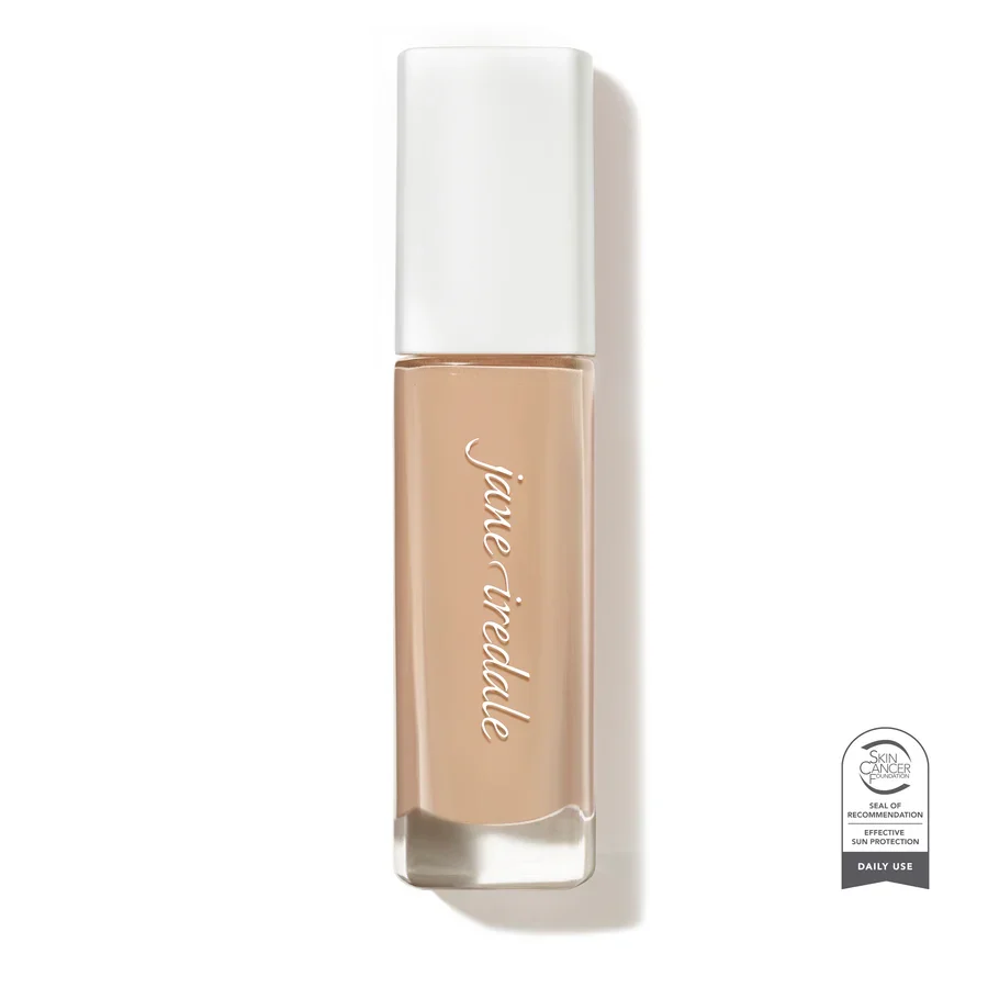 Skintuition_20_Light_Soldier_SCFwebp – Damara Luxury Spa Vancouver Nude beige nail polish bottle with a white cap, brand name scripted vertically on the bottle, and a certification seal badge at bottom-right.
