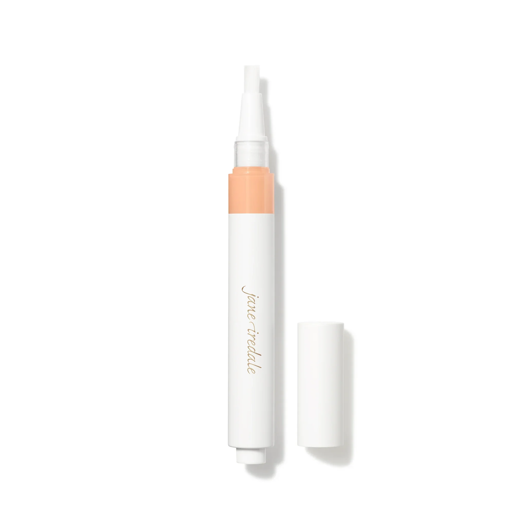 Skintuition_Concealer_Soldier_LM5_2000xwebp – Damara Luxury Spa Vancouver Close-up of a white cosmetic spray pen with a peach band around the bottom and gold script on the side.