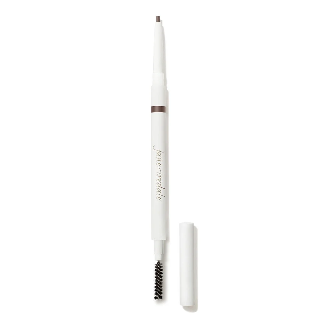 auburnpencilwebp – Damara Luxury Spa Vancouver White retractable brow pen with a fine tip and a built-in spoolie brush at the end, labeled Jane Iredale, shown with cap removed