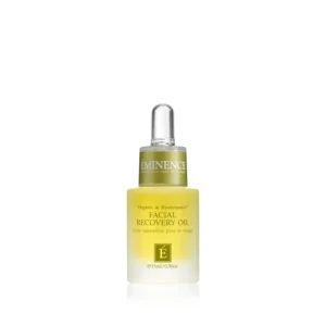 Bottle of Eminence Facial Recovery Oil with a dropper cap, yellow gradient label reading "FACIAL RECOVERY OIL" and logo above it.
