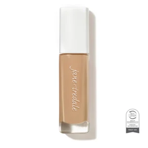 Vertical nude lipstick tube with a white cap, brand name in cursive along the side, shown upright near a Skin Cancer Foundation seal badge on the right.