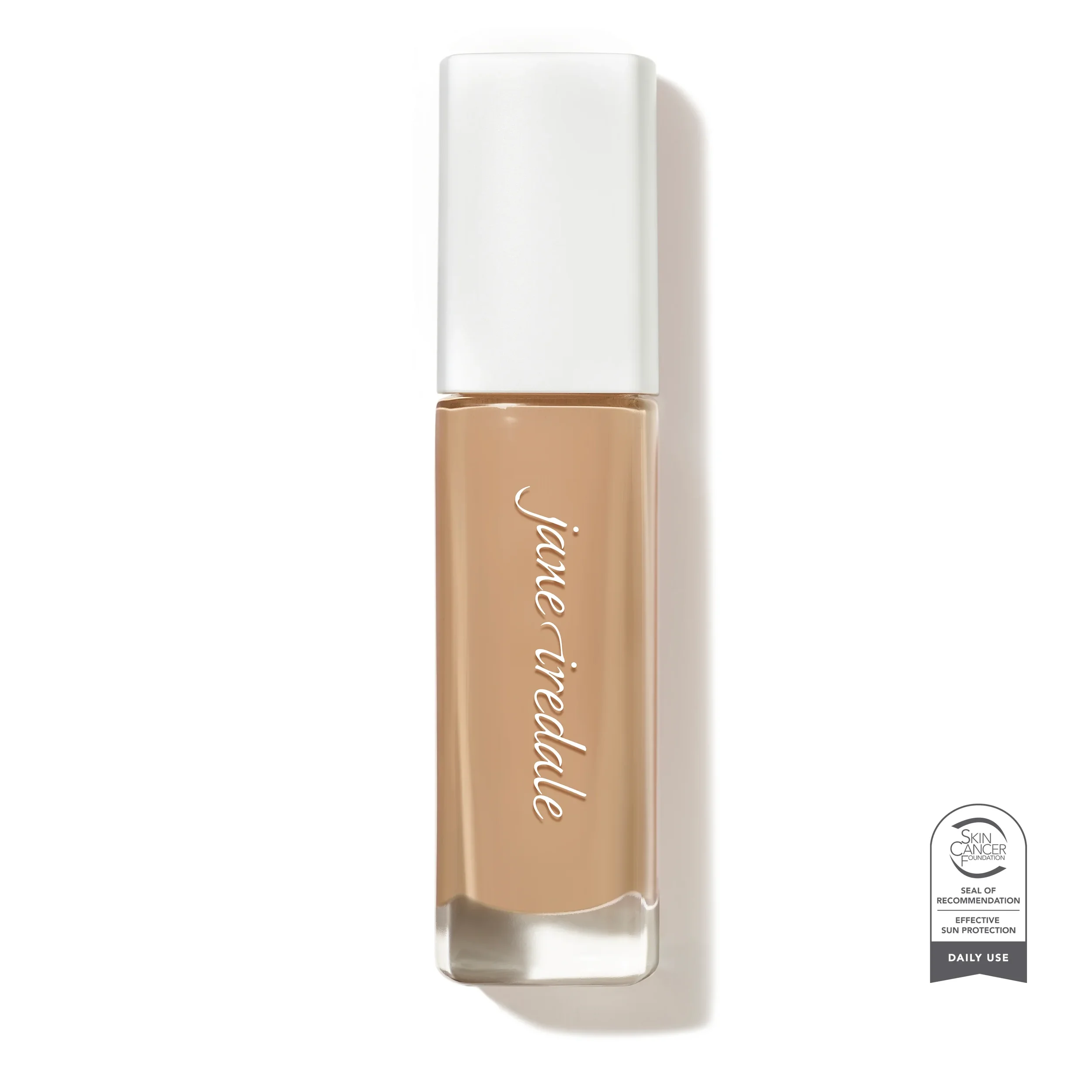jane-iredale-Skintuition_30_Light_Medium_Soldier_SCF_c6e8b3d4-850d-4419-9e55-3b6441f92351_5000xwebp – Damara Luxury Spa Vancouver Vertical nude lipstick tube with a white cap, brand name in cursive along the side, shown upright near a Skin Cancer Foundation seal badge on the right.