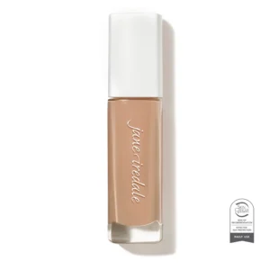 Close-up of a nude lipstick tube with a white cap, beige-brown shade visible at the base and a Skin Cancer Foundation seal in the bottom-right corner.