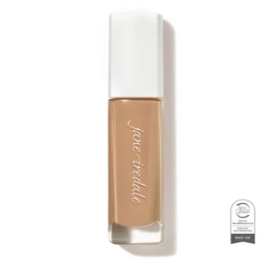 Close-up of nude lipstick with a white cap, upright in a beige-brown shade.
