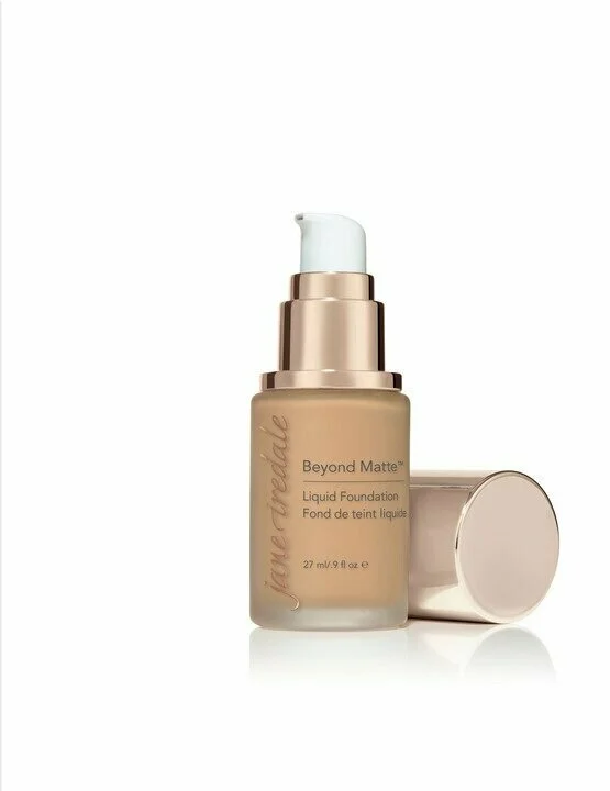 m9webp – Damara Luxury Spa Vancouver Bottle of Jane Iredale Beyond Matte liquid foundation with pump, beige shade, cap set beside on white background.
